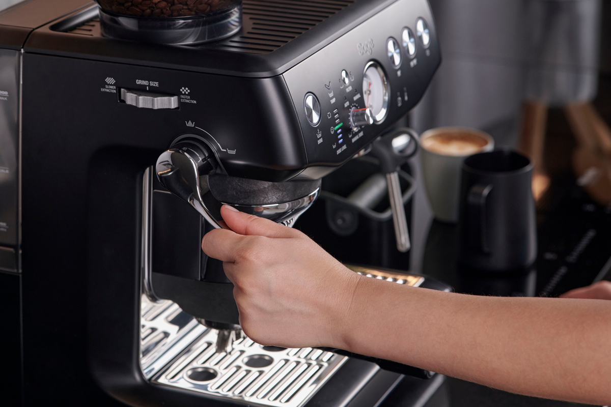 Sage Barista Express Impress SES876 in Black Truffle on a kitchen counter